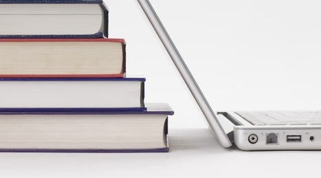 Stack of books and laptop computer